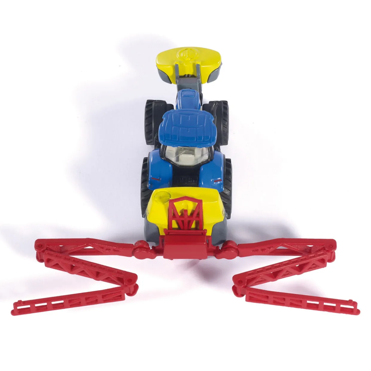 SIKU TRAKTOR NEW HOLLAND MED BESPRUTNINGSSLÄP 1:87